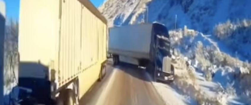 WATCH: Trucker successfully threads the needle through potential truck pile-up